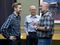Representitive-elect Jason Grenn, of Anchorage, talks with Reps. Jonathan Kreiss-Tomkins of Sitka, center, and Adam Wool, of Fairbanks. Alaska House representatives announced a 22-member majority coalition made up of Democrats, Republicans and independents on Wednesday, November 9, 2016, at the Dimond Center Hotel in Anchorage. (Marc Lester / Alaska Dispatch News)