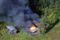 Structures burn about 40 miles north of Grayling on Sunday, Aug. 27, 2017, on the Yukon River. (Jeff Higginbotham)