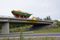 Deere John sails across Eklutna overpass and onto the Glenn Highway on June 27, 2017. (Rick Sinnott)